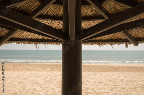 close up of a tropical parasol in the south of Vietnam  south east asia is so lovely  with beach and ocean in the background