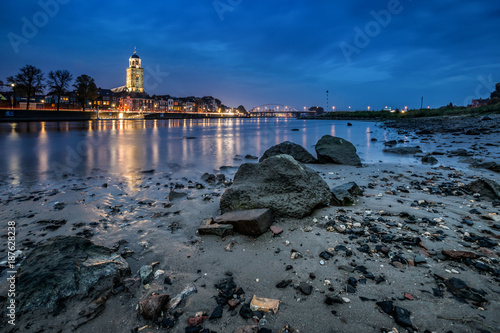 An evening scene of a river landscape in the Netherlands at the town of Deventer photo