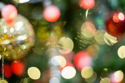 Colorful Red  Yellow and Green Christmas Tree Bokeh background of de focused glittering lights 