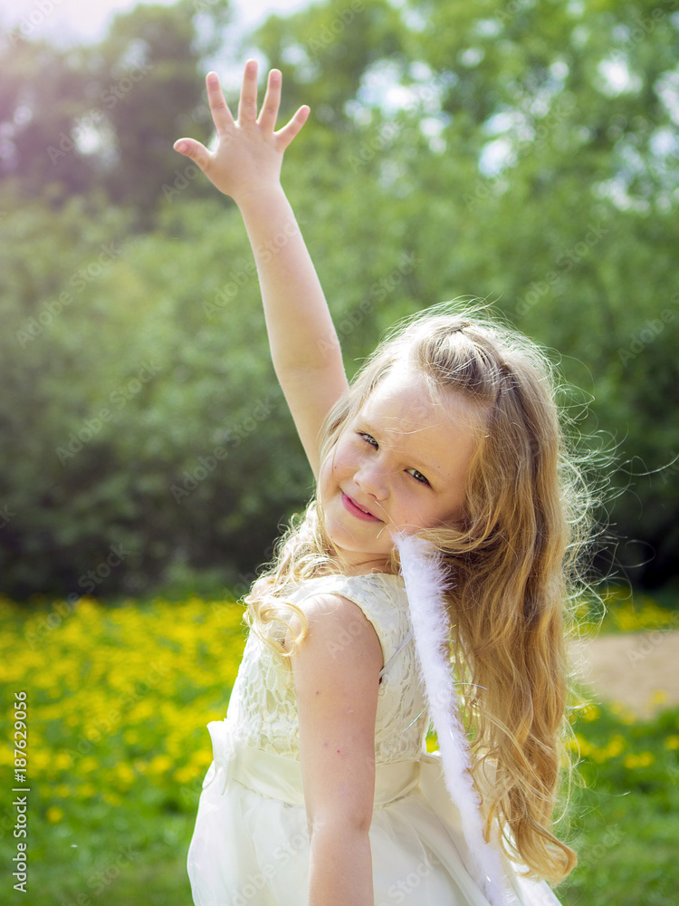 Girl with angel wings on the background of nature. Girl with angel wings on the background of nature.