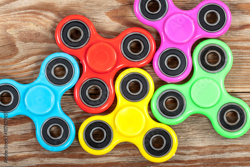 Group of spinners on wooden table
