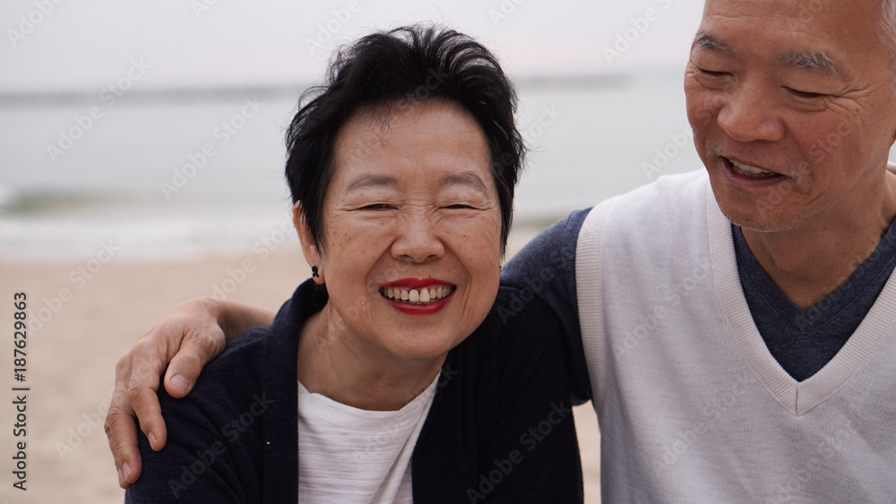 Asian senior couple enjoy their life time together at the sea Asian senior couple enjoy their life time together at the sea