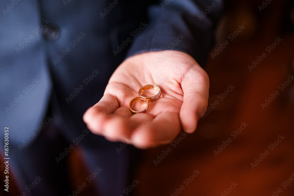 Wedding rings in the hands of men. Wedding rings in the hands of men.