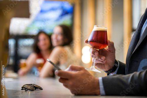 Drink a beer with a friend and flirt with an interesting man in a suit drinking beer