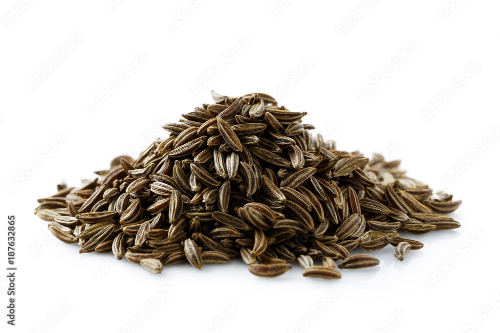 A pile of dry caraway or cumin seeds isolated on white. A pile of dry caraway or cumin seeds isolated on white.