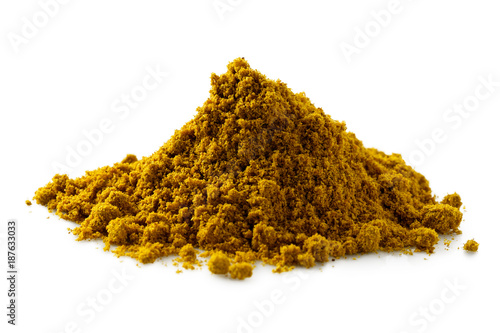 A pile of ground masala spice mix isolated on white.