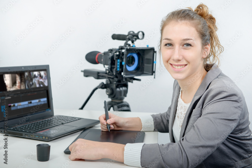 young woman designer using graphics tablet for video editing young woman designer using graphics tablet for video editing