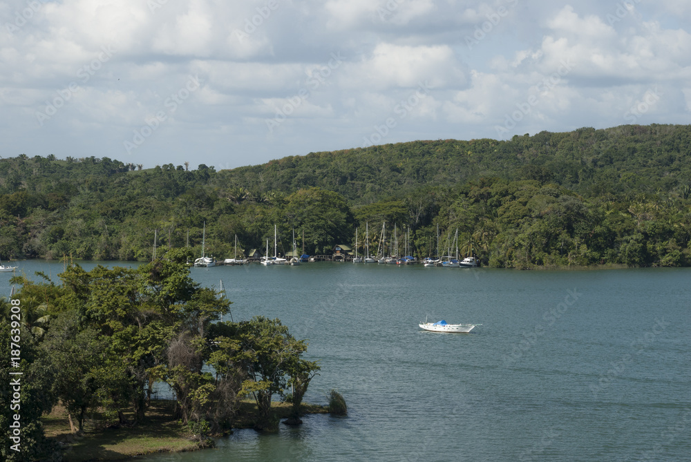 Boat anchored in waters of the River called Dulce in Izabal Guatemala, central America.