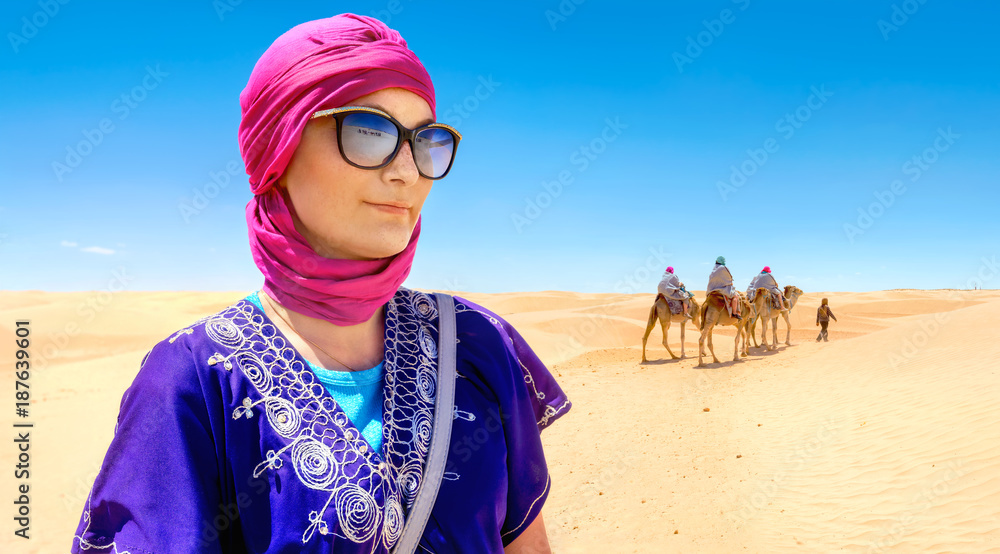 Beautiful woman in arabic traditional clothing against Sahara desert  background. Tunisia, North Africa Stock Photo | Adobe Stock