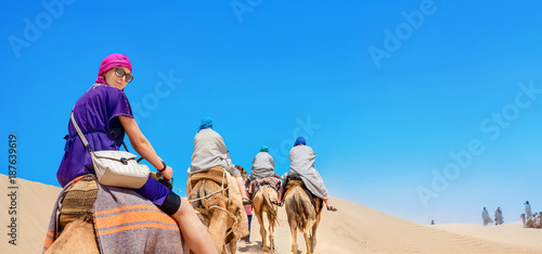 Obraz na płótnie Safari tourism on camels. Sahara desert, Tunisia, North Africa w salonie