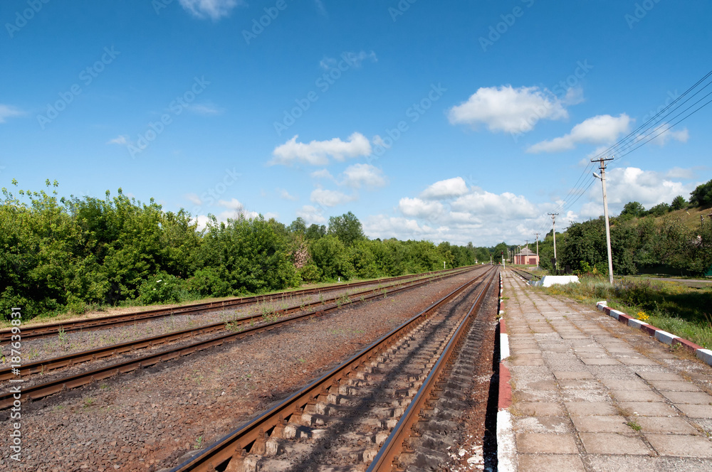 Small train station. Village train stop. Railroad tracks, railroad switch, point.