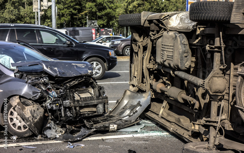 The ambulance ran into a car and rolled over