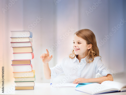 happy smiling student girl counting books