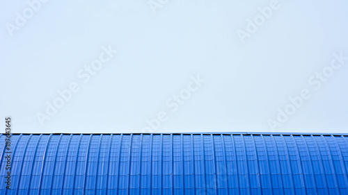 modern blue metal roof on blue sky