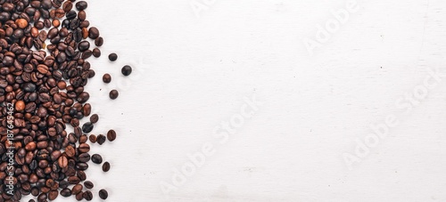 Coffee beans. On a wooden background. Top view. Copy space.