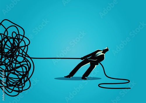 Businessman trying to unravel tangled rope or cable
