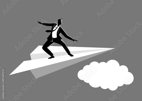 Businessman balancing on paper plane