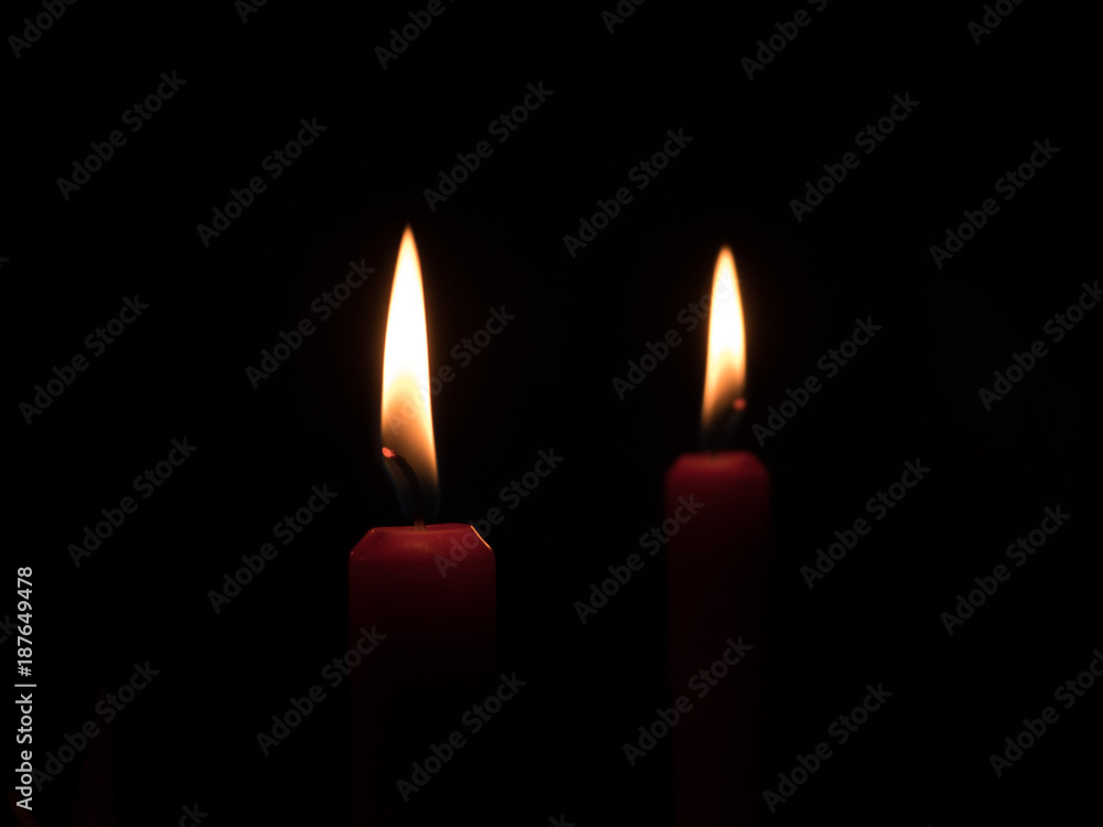 flame of a candlelight in the darkness flame of a candlelight in the darkness