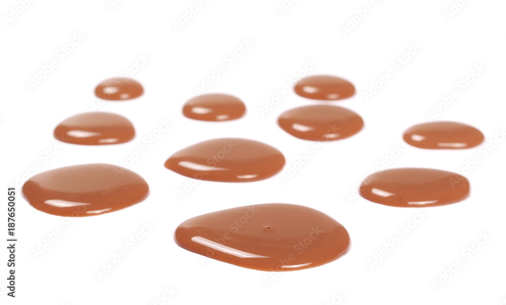 Spilled chocolate milk puddle isolated on white background Spilled chocolate milk puddle isolated on white background