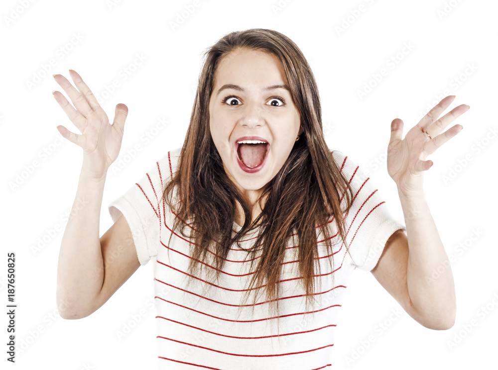 Happy young woman with opened mouth and wearing white shirt smiling and looking camera isolated