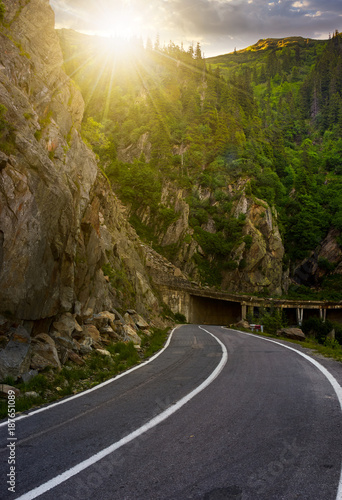 tunnel on Transfagarasan road of Romania. dangerous transportation scenery among the rocky cliffs in high Carpathian mountains in summer morning. 