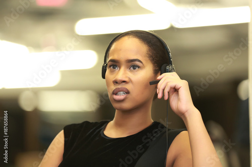 Mixed race woman talking in call center