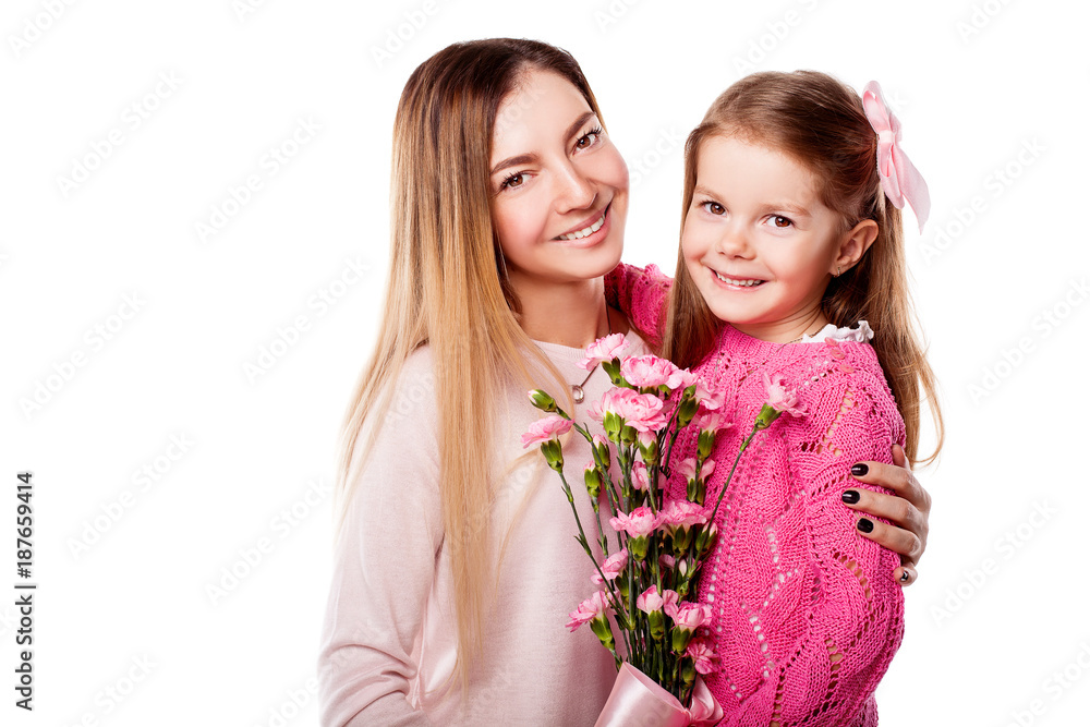 Portrait of happy mother and daughter with bouquet of pink carnations isolated on white. Daughter embrasing mother. Happy family. Happy mother's day. Mothers day card. Hug day Portrait of happy mother and daughter with bouquet of pink carnations isolated on white. Daughter embrasing mother. Happy family. Happy mother's day. Mothers day card. Hug day