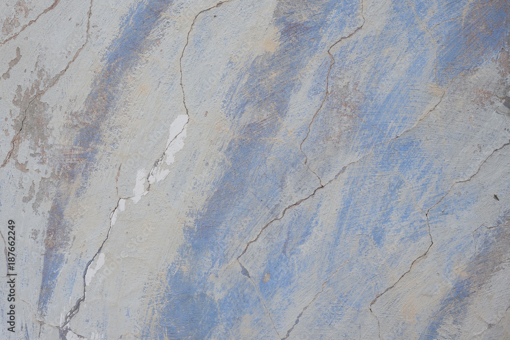 Fototapeta premium Wall fragment with scratches and cracks