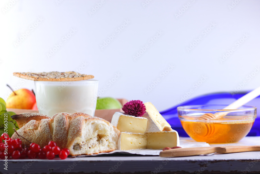 Cheese with mold, camembert with honey, purple bottle, Greek roll with cottage cheese, peanuts and pink flower, healthy food, milk in a glass with biscuits, pop art, retro style Cheese with mold, camembert with honey, purple bottle, Greek roll with cottage cheese, peanuts and pink flower, healthy food, milk in a glass with biscuits, pop art, retro style