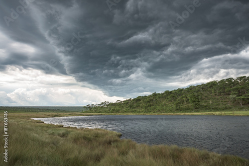 Tempestade de verão na lagoa da nascente do rio Cuanavale em Angola, província do Moxico photo