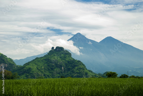 The mountains and volcano of Fuego rural scenery in summer. Guatemala, sugar cane.