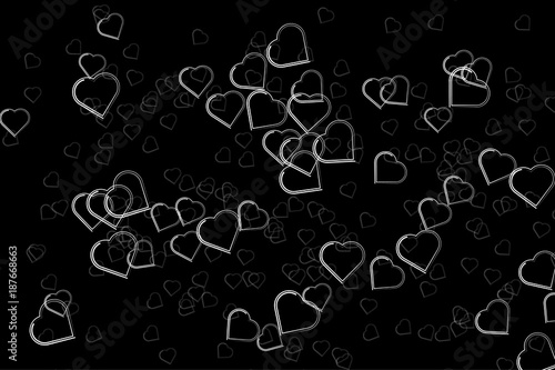 Silhouettes of heart symbols on a black backdrop. Beautiful abstract background.