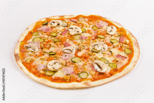 Pizza with four kinds of meat and cucumbers on a white background.