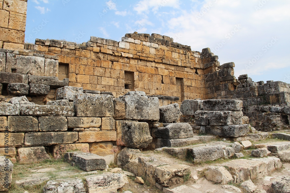 The ruins of the ancient Hierapolis city next to the travertine pools of Pamukkale, Turkey.