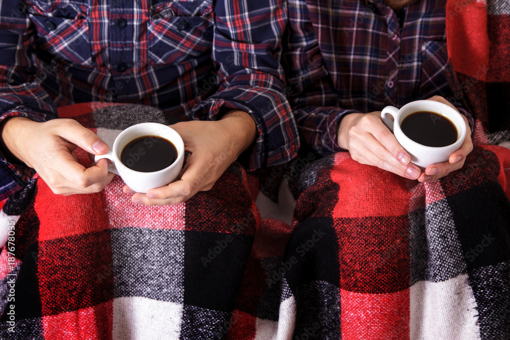 © NataliAlba - Young hands two cups hot plaid female man coffee shirt cage © NataliAlba - Young hands two cups hot plaid female man coffee shirt cage