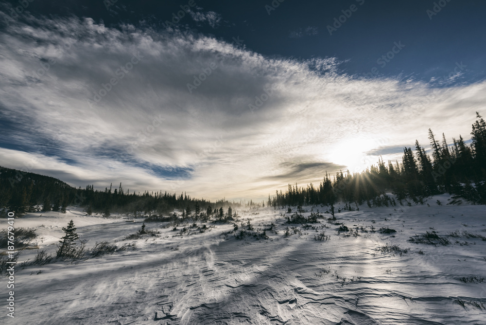 Scenic view of snow covered landscape against cloudy sky Scenic view of snow covered landscape against cloudy sky