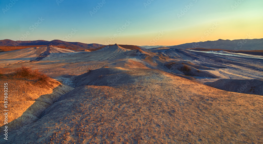 Sunrise in the Muddy Volcanoes National Reservation in Romania,Berca,Buzau,Vulcanii Noroiosi. Muddy Volcanoes landscape. Sunrise in the Muddy Volcanoes National Reservation in Romania,Berca,Buzau,Vulcanii Noroiosi. Muddy Volcanoes landscape.
