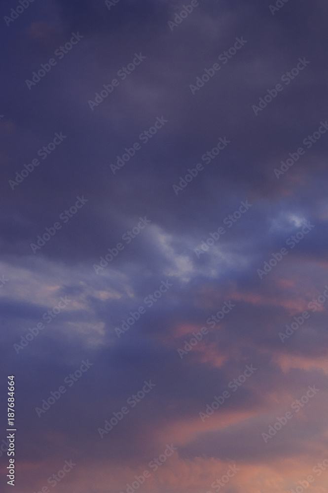 The vertical view of sky background or texture at the sunset time with clouds. Copy space The vertical view of sky background or texture at the sunset time with clouds. Copy space
