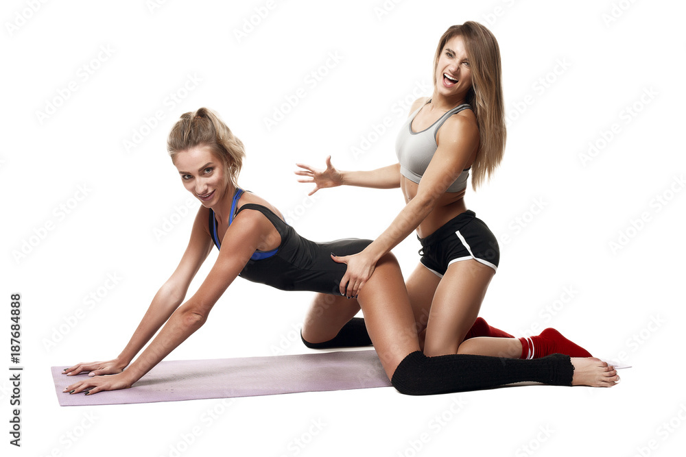 two girls made stretching isolated white backround two girls made stretching isolated white backround