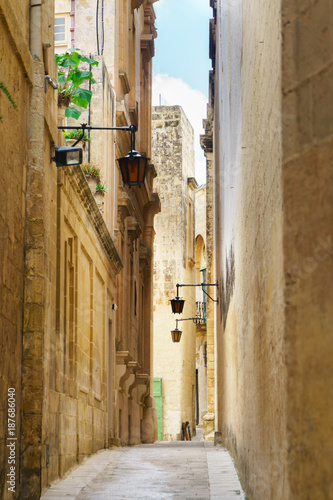 Quiet narrow desert medieval street in silent city Mdina  Malta. Travel postcard vacation concept. Copy space. Vintage effect.