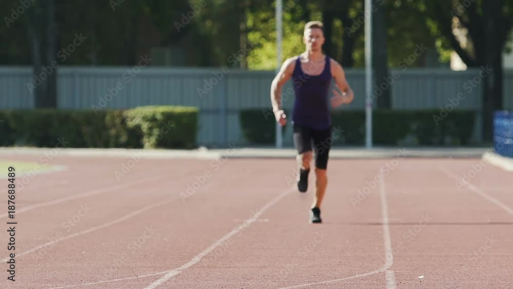 Professional athlete training every day at stadium, running outdoors slow-motion Professional athlete training every day at stadium, running outdoors slow-motion