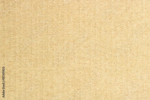 Texture of brown cardboard, vertical stripes, abstract background