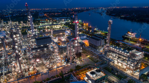 Aerial view of Oil and gas industry - refinery, Shot from drone of Oil refinery and Petrochemical plant at twilight, Bangkok, Thailand © Travel mania