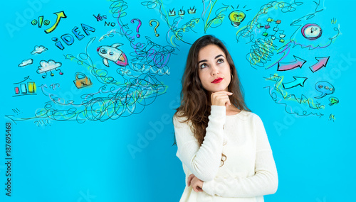 Young woman with many thoughts on a blue background
