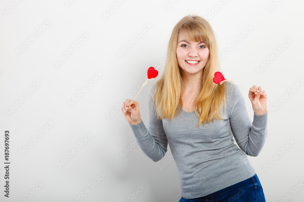 Cheerful girl fooling with hearts. Cheerful girl fooling with hearts.