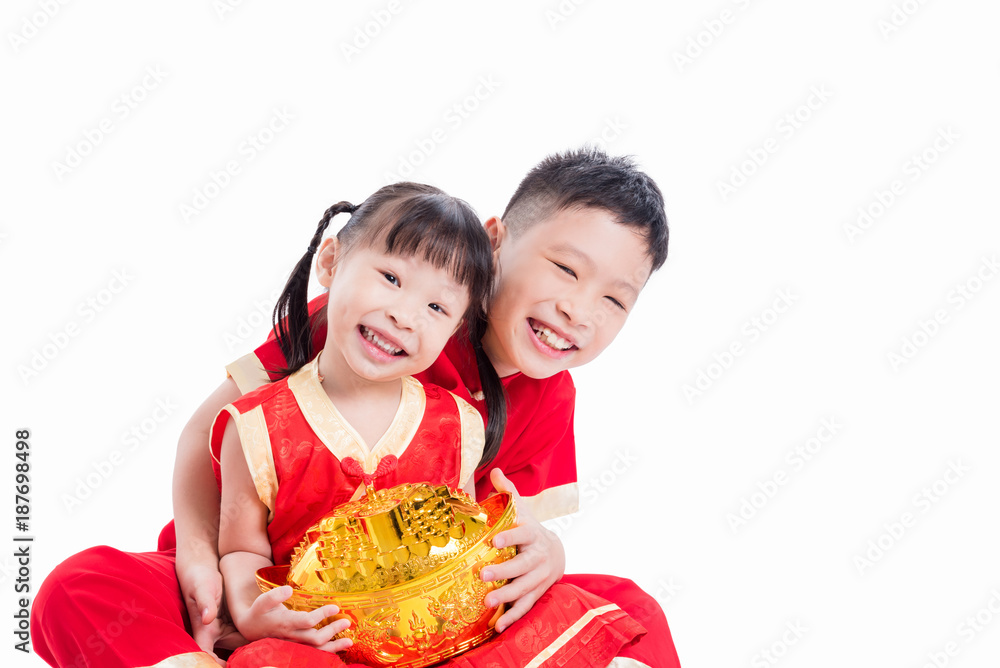 Young chinese siblings holding money bank and smiling over white background Young chinese siblings holding money bank and smiling over white background