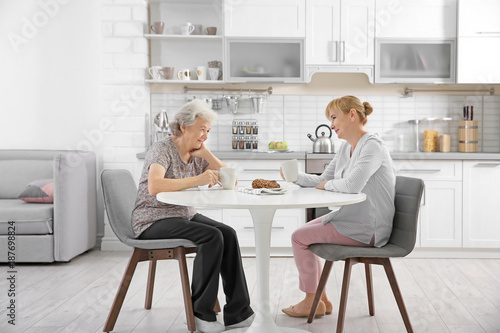 Senior woman and caregiver ...