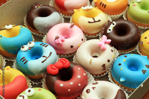 Collection of lovely cute cake donut for children birthday partty, Cartoon childlike character for kids, Lovely snacks. photo