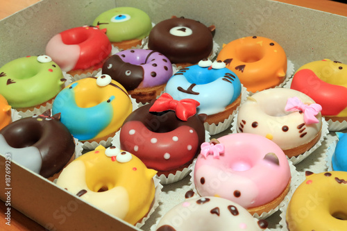 Collection of lovely cute cake donut for children birthday partty, Cartoon childlike character for kids, Lovely snacks. photo