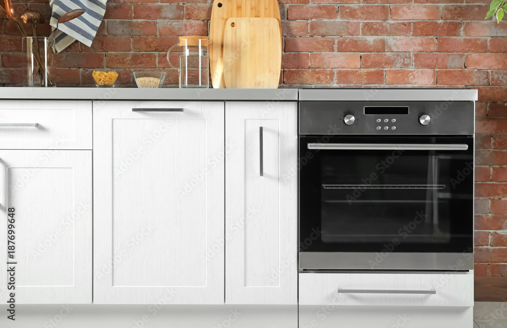 © Africa Studio - Modern kitchen interior with new oven © Africa Studio - Modern kitchen interior with new oven